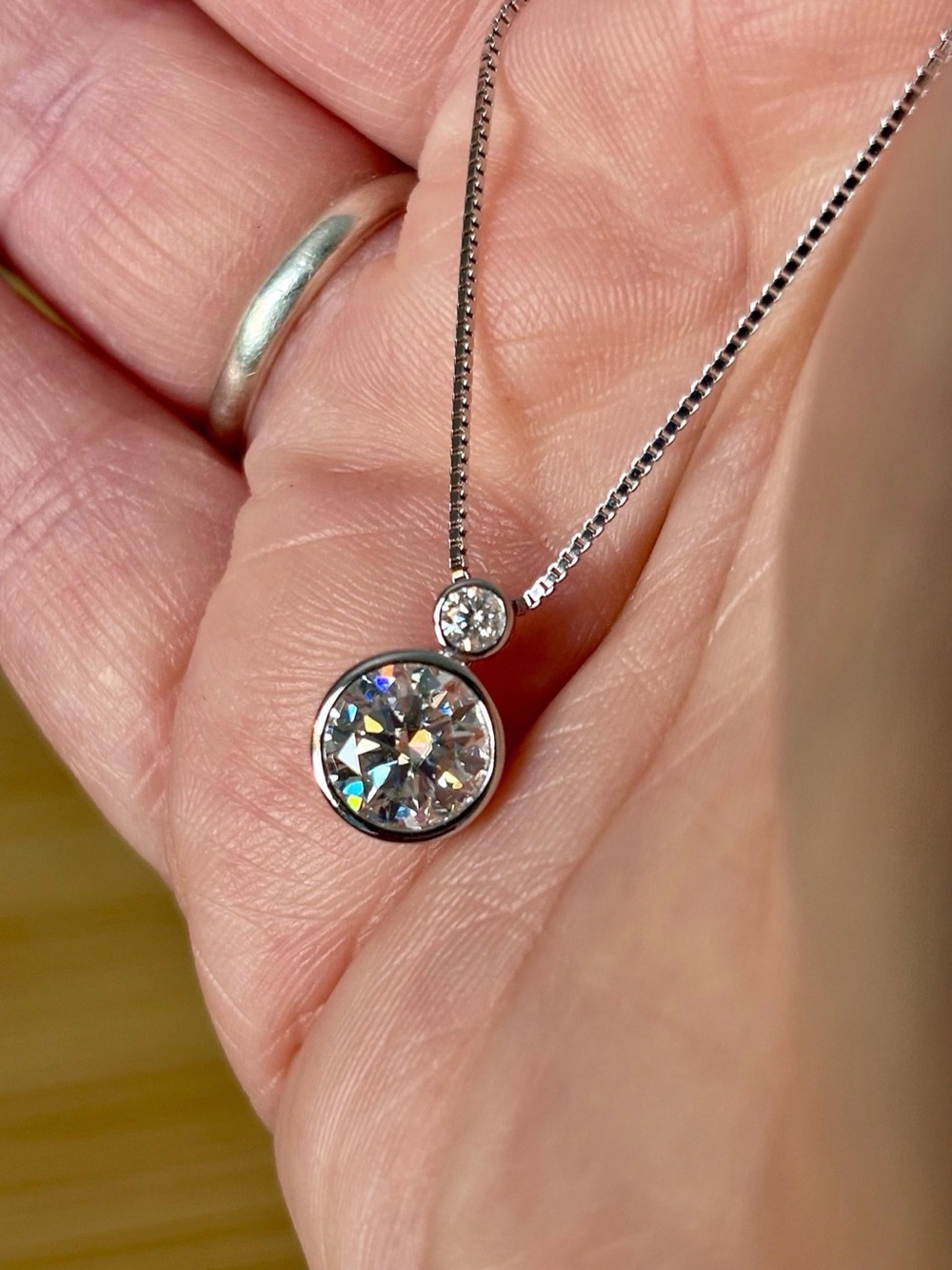 2.1ctw bezel-set Moissanite 2-stone necklace in sterling silver!